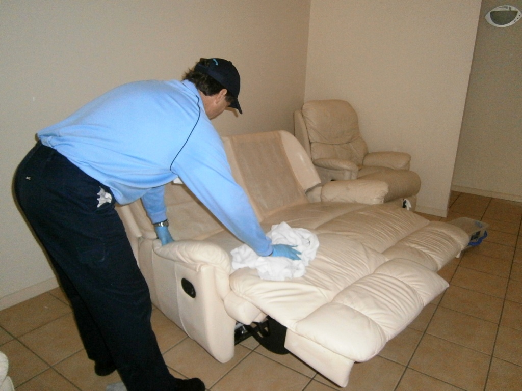 Professional leather lounge cleaning in progress