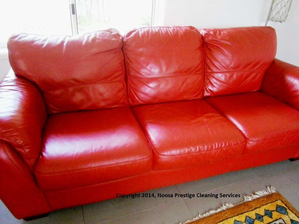 Red leather lounge after professional cleaning